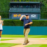 Man throwing pitch next to Detroit Tigers mascot pt. 2